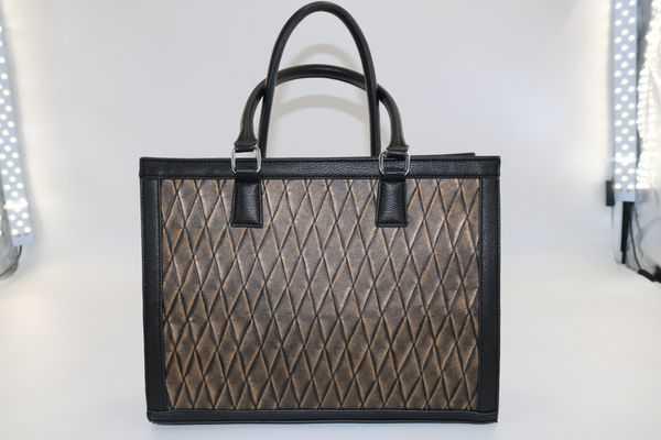 A washable kraft paper tote bag with quilted pattern